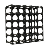 The Stakrax 30 Bottle Plastic Wine Rack in black by Stakrax features a modular design with five rows and columns, each square compartment has a circular center opening. Empty and shown against a white background, it's perfect for expandable wine storage.