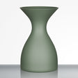 The Sydonios Small Wine Tasting Spittoon 630ml in jade green, featuring an hourglass shape and a matte finish, is displayed on a reflective surface against a plain white background.
