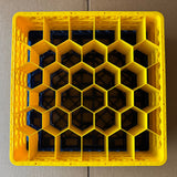 A top-down view shows a yellow Wineware USED - GREAT CONDITION Traex Rack Master Glass Washer Tray (500 x 500 x 200mm, 30 glass capacity, 81mm cells) with a honeycomb pattern, placed on cardboard.