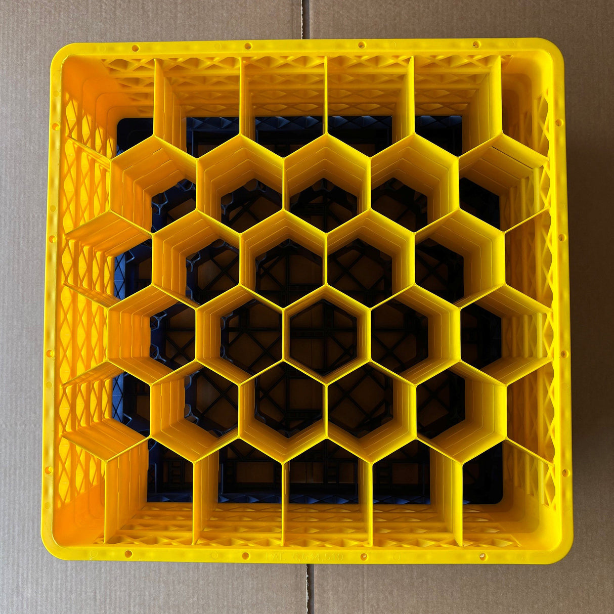 A USED Wineware Traex Rack Master Glass Washer Tray (500x500x240mm) for 30 glasses with 81mm cells, yellow plastic with a hexagonal grid. Great condition and perfect for commercial glassware washing.