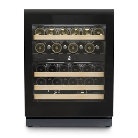 The Liebherr Vinidor UWgb 3632 is a glass-fronted, undercounter wine cabinet holding 32 bottles on four wooden shelves, with two temperature zones, a black frame, and an interior digital display.