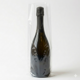 A Wineware Champagne & Magnum Wine Bottle Cellar Sleeve/Bags protects an upright dark glass bottle and keeps it dust-free against a plain white background.